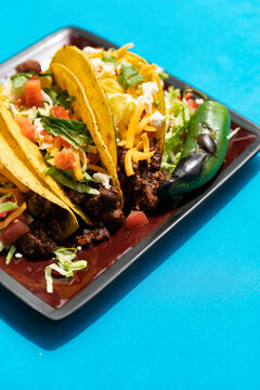 Cinco: Three Tacos On Plate With Garnish