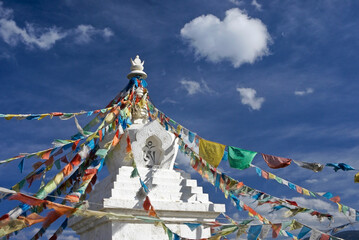 Tibetan stupa with prayer flags in Shangri-la, Yunnan Province, China