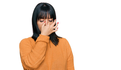 Young hispanic woman wearing casual clothes tired rubbing nose and eyes feeling fatigue and headache. stress and frustration concept.