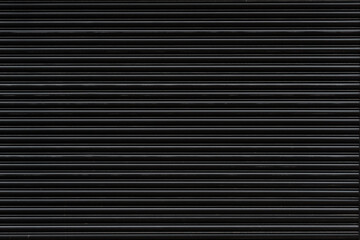 The black metal has a straight line for the background.