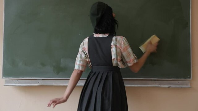 girl in a classroom. Woman back to school. 
