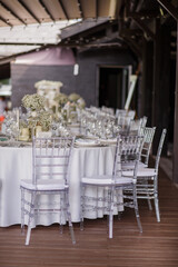 Wedding table decoration with white wildflowers and candles. Decor Celebrating concept.
