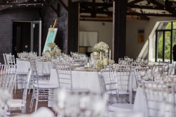Wedding table decoration with white wildflowers and candles. Decor Celebrating concept.
