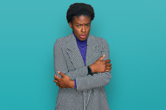 Young african american girl wearing casual clothes shaking and freezing for winter cold with sad and shock expression on face