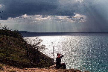 Naklejka premium Woman looking at scenic view of Lake Baikal