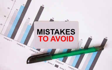 Business card with text Mistakes To Avoid. Diagram and green pen