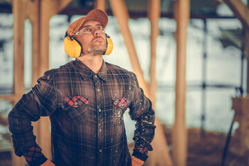 Construction Contractor Wearing Noise Reduction Headphones