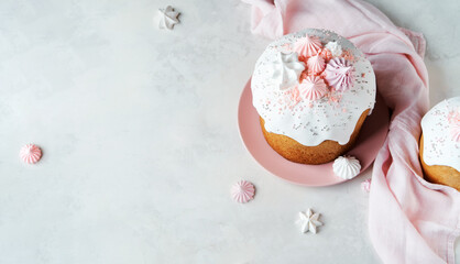 Traditional Russian Rustic Easter Kulich Cakes with Marshmallow Icing and confectionery sprinkles as Decoration on white background with copy space. Happy  Easter-Orthodox holiday flat lay banner.