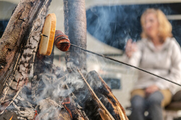 Polish Sausage Baking on a Campfire