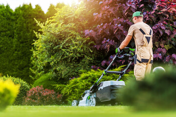 Residential Garden Worker Trimming Backyard Lawn - obrazy, fototapety, plakaty