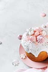 Traditional Russian Easter Cake with Decoration with Marshmallow, Sweet Filling, Icing and confectionery sprinkles  on pink plate. Happy Light Easter-Orthodox holiday background.