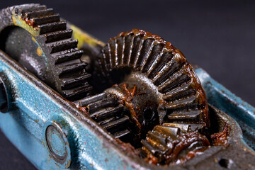 Bevel gear lubricated with grease. A mechanism for transmitting torque in a mechanical device.
