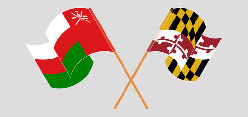 Crossed and waving flags of Oman and the State of Maryland
