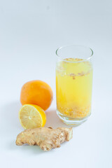 glass of orange juice and lemon and ginger 