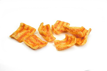 Bacon Chips. Delicious bacon snacks isolated on white background. Pelleted salted snack bacon. Smoked bacon flavored chips.