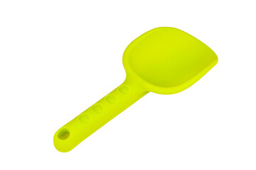 Green children's scoop. The child's shoulder blade is green, on a white background, isolated.