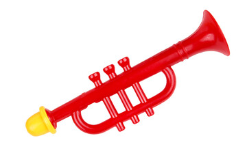 Toy trumpet of red color. Children's musical instrument. On a white background, isolated.
