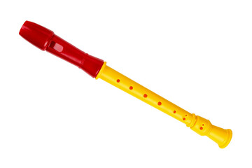A toy children's flute. Red flute. Children's musical instrument. Isolated on a white background.