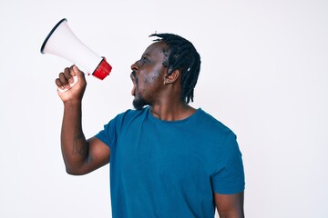 Young handsome african american man screaming using megaphone over isolated white background