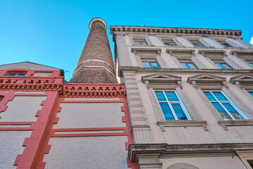 Old vintage building and kiln shaft extends to blue sky in istanbul.
