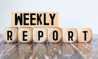 Weekly Report Word alphabet letters on wooden background