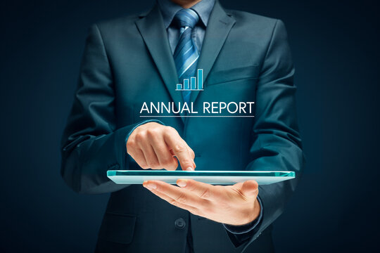 Financier read annual report on digital tablet