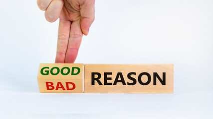 Good or bad reason symbol. Businessman turns cubes and changes words 'bad reason' to 'good reason'. Beautiful white background. Copy space. Business, good or bad reason concept.