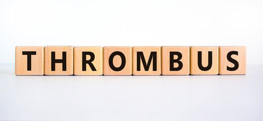 Medical and and thrombus symbol. Wooden cubes with the word 'thrombus'. Beautiful white background....