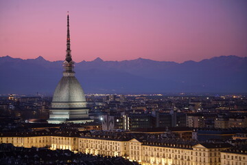 Fototapeta na wymiar Night view of the illuminated Mole Antonelliana. Turin, Italy - March 2021