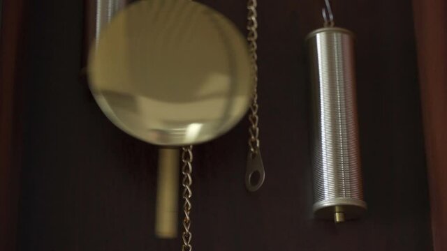 The pendulum of the antique clock. Time Concept