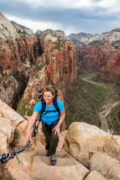 A woman hiking Angel's Landing,  West Rim Trail, Zion National Park, Springdale, Utah.