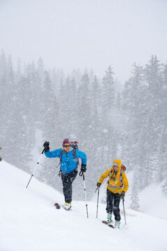 A couple backcountry skiing in Commodore Gulch, Red Mountain Pass, Uncompahgre National Forest, Ouray, Colorado.