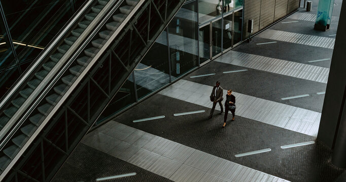 High angle view of male and female entrepreneurs on walkway