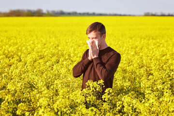 man in rapeseed field.