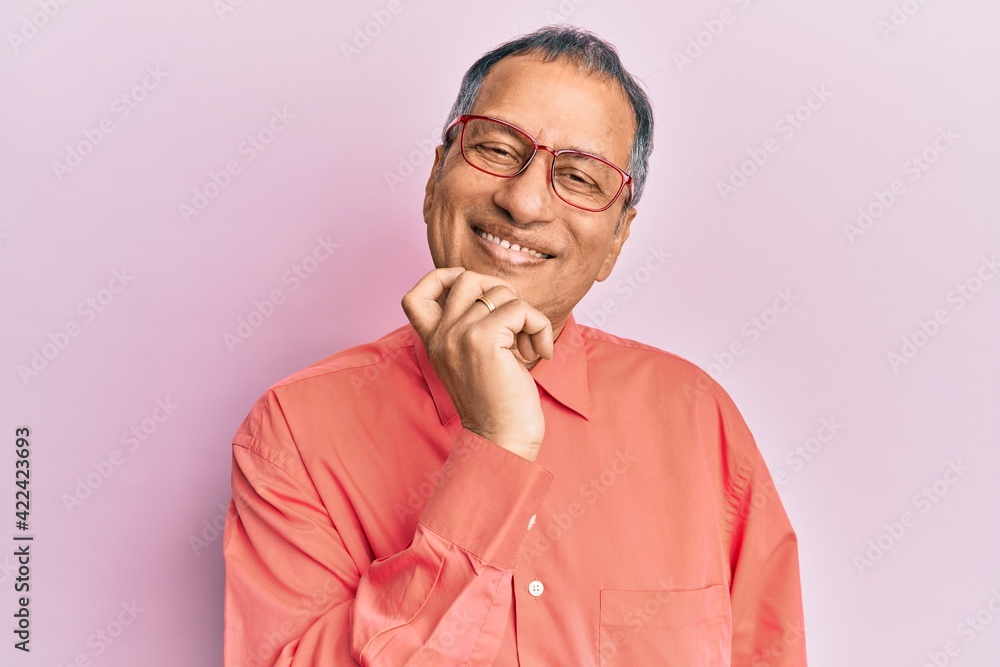 Canvas Prints middle age indian man wearing casual clothes and glasses looking confident at the camera with smile 