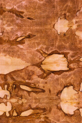 detail of a pattern in brown-ocher batik on a cotton fabric