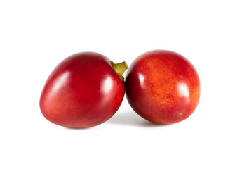 Tamarillo isolated on a white background. Two whole red fruits.