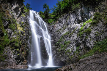 long daytime exposure of the huge waterfall of Saut deth Pish in the Aran Valley, Catalan Pyrenees,...
