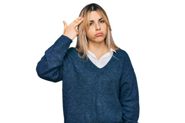 Young caucasian woman wearing casual clothes shooting and killing oneself pointing hand and fingers...