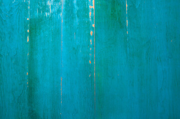 Wooden background painted with weathered green paint