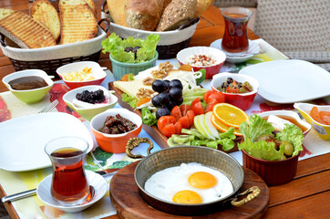 turkish breakfast with egg tomatoe cheese tea and jam
