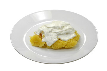 Polenta with Cheese and Sour Cream in a Plate isolated on white background.