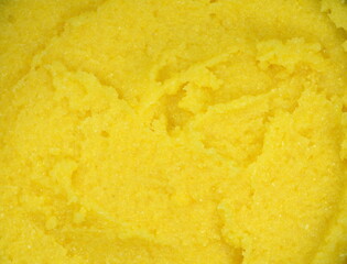 boiled yellow polenta texture background.