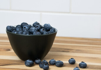 Blueberries in a bowl- cutting board