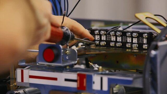 Cables are screwed into a patchbay