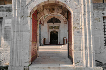 Fototapeta na wymiar Turkey istanbul 04.03.2021. Hatice Turhan Sultan tomb in istanbul and its gate opens to garden inside the tomb building. Arabic details on gate and ottoman style architecture