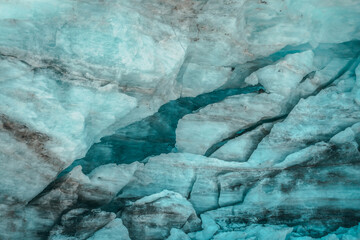 Minimalist nature background of glacier surface with cracks and scratches close up. Minimal natural...