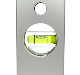 Green bubble level isolated on a white background with clipping path. Construction level ruler...