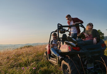 group young happy people enjoying beautiful sunny day while driving a off road buggy car
