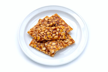 Honey bars with peanuts on white background